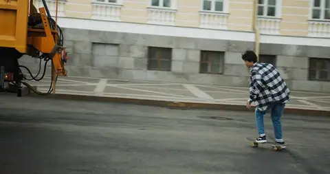 Skateboarder hitching a ride