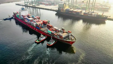 Container ship with Tugs